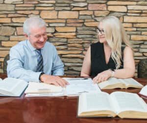 man and woman lawyers researching